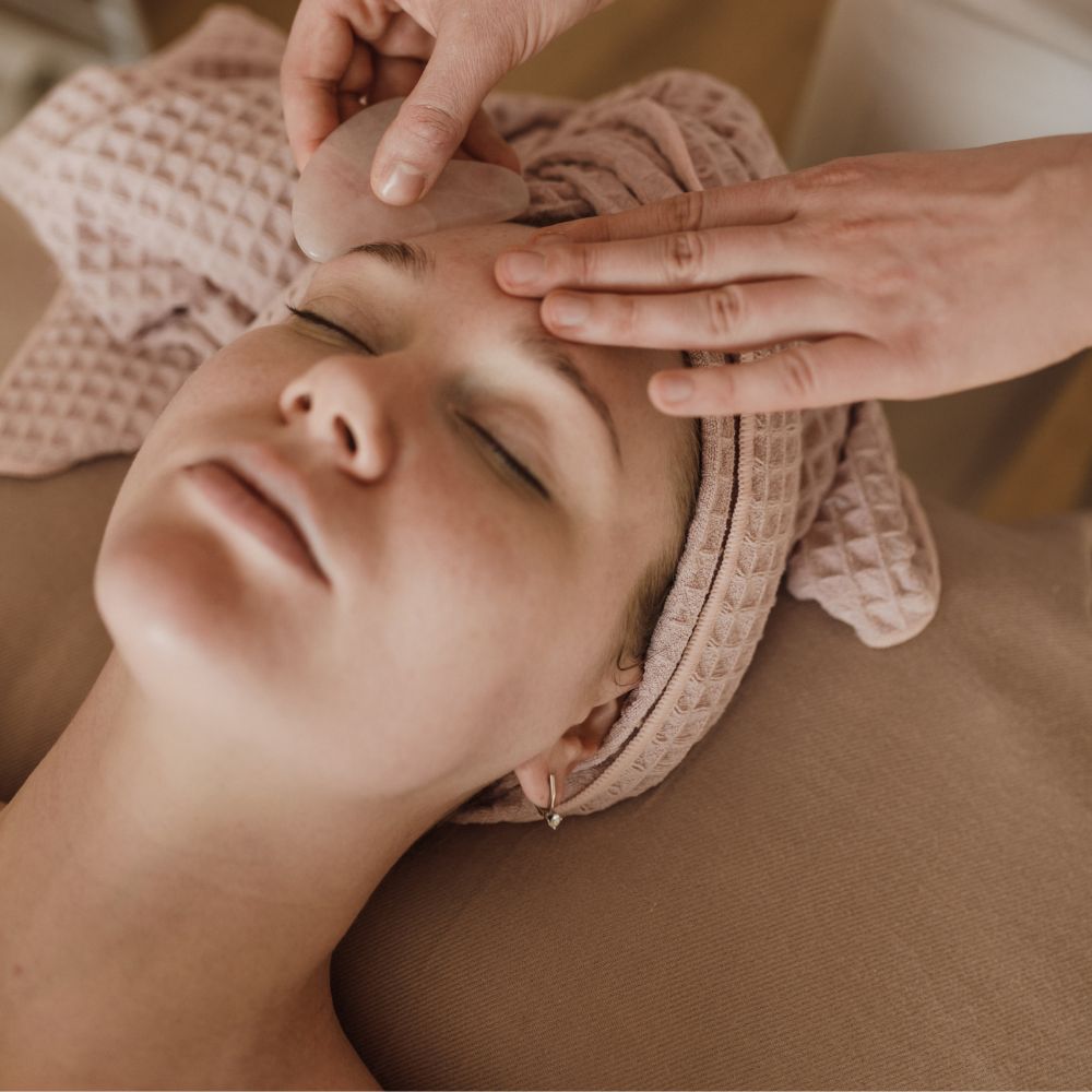Woman having a beauty treatment on her forehead